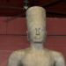 Sandstone Harihara statue from Phnom Da, a seventh-century fusion of Shiva and Vishnu, standing head reattached in the National Museum of Cambodia’s red-walled gallery in Phnom Penh