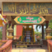Colorful outdoor altar at Wat Sophy, Takeo, in Cambodia, decorated with Buddha images, fruits, candles, and offerings prepared to welcome the 2026 Khmer New Year angel beneath golden reliefs of the Buddha’s life.