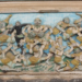 Ancient relief carving depicting Rama's monkey army warriors in dynamic battle poses from Wat Damrei Sa temple in Battambang Cambodia