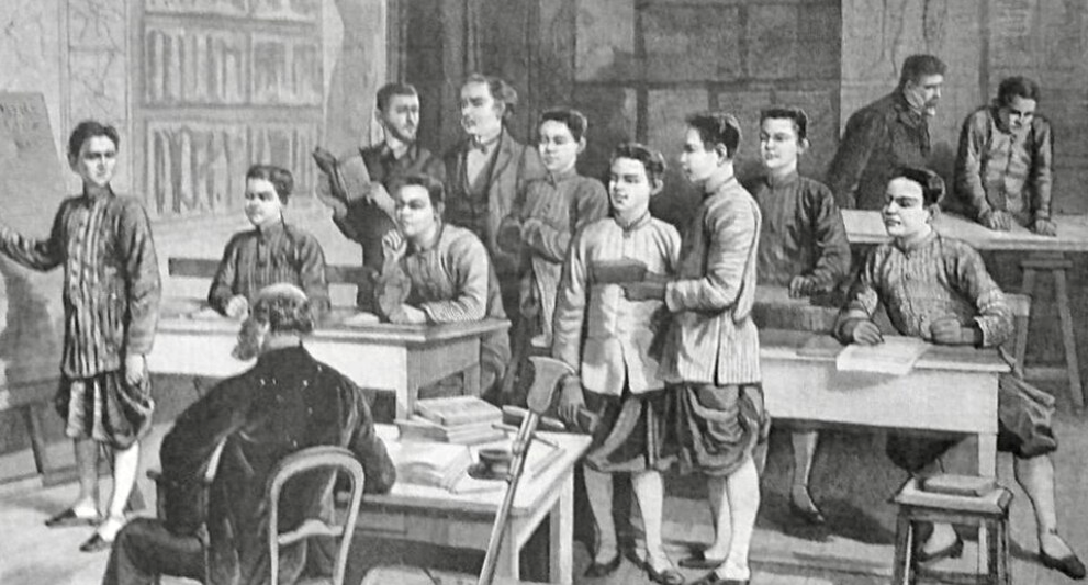 Black and white illustration of a classroom at the École cambodgienne in Paris, showing Cambodian male students in traditional garments standing and sitting at wooden desks while two European teachers supervise the lesson from the front and back of the room.