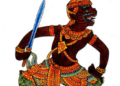 Illustration of Sugrib, the Khmer monkey king, shown in dynamic profile with dark red skin, ornate gold and green costume, pointed crown and a raised sword against a white background