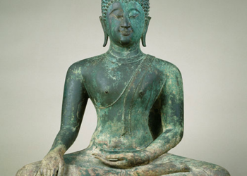 Fourteenth century Sukhothai bronze Buddha statue seated cross-legged in meditation, right hand resting on knee, left hand in lap, with flame-like finial on top of the head.