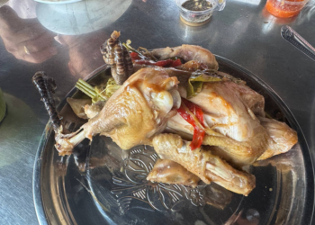Traditional roasted chicken served at Phnom Chisor, Cambodia, prepared from naturally fed free-range chickens with herbs and local seasonings.