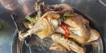 Traditional roasted chicken served at Phnom Chisor, Cambodia, prepared from naturally fed free-range chickens with herbs and local seasonings.