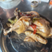 Traditional roasted chicken served at Phnom Chisor, Cambodia, prepared from naturally fed free-range chickens with herbs and local seasonings.
