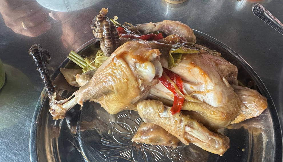 Traditional roasted chicken served at Phnom Chisor, Cambodia, prepared from naturally fed free-range chickens with herbs and local seasonings.