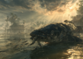 A large, dark snakehead fish lies in shallow floodwater near Cambodian stilt houses, gripping several small baby fish in its mouth as others scatter, with dramatic sun rays breaking through stormy clouds overhead