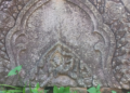 Close-up of an intricately carved sandstone decorative panel at Phnom Chisor Temple in Takeo Province, showcasing the craftsmanship of ancient Khmer artisans.