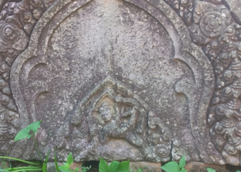 Close-up of an intricately carved sandstone decorative panel at Phnom Chisor Temple in Takeo Province, showcasing the craftsmanship of ancient Khmer artisans.