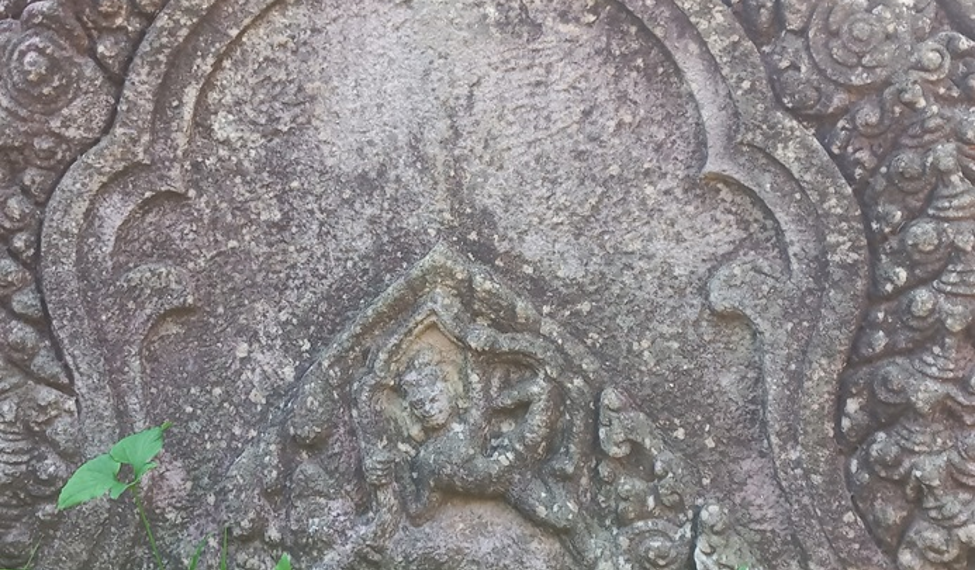 Close-up of an intricately carved sandstone decorative panel at Phnom Chisor Temple in Takeo Province, showcasing the craftsmanship of ancient Khmer artisans.