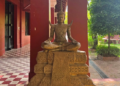 Statue of King Sisowath seated in a traditional Khmer pose at the Royal University of Fine Arts in Phnom Penh, Cambodia.