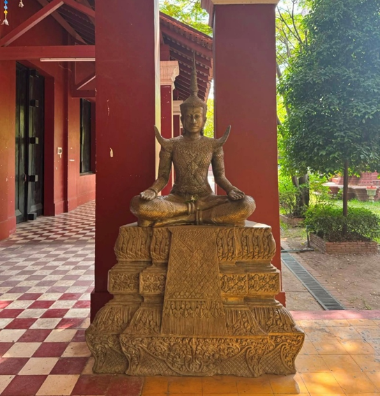 Statue of King Sisowath seated in a traditional Khmer pose at the Royal University of Fine Arts in Phnom Penh, Cambodia.
