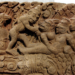 Khmer-style stone relief depicting the death of Valin, with the monkey king surrounded by other figures in a dramatic battle scene.