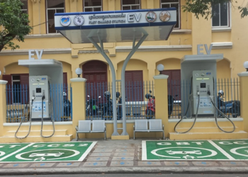 Public EV charging station near Wat Phnom in Phnom Penh, Cambodia, with fast chargers for electric cars in an urban setting.