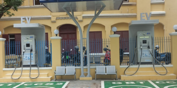 Public EV charging station near Wat Phnom in Phnom Penh, Cambodia, with fast chargers for electric cars in an urban setting.