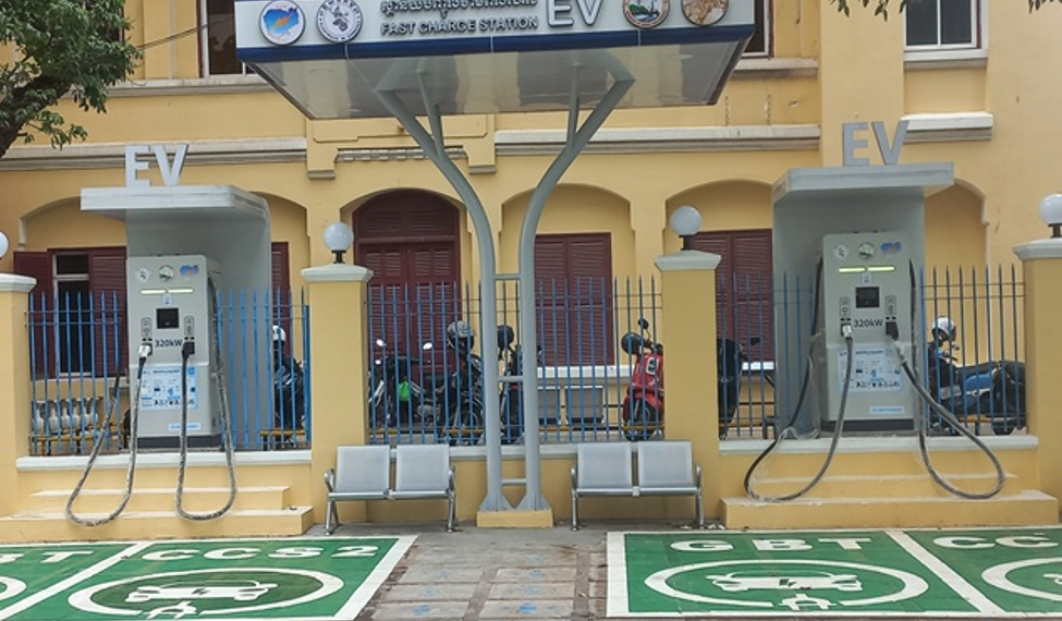 Public EV charging station near Wat Phnom in Phnom Penh, Cambodia, with fast chargers for electric cars in an urban setting.