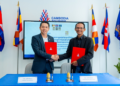 Representatives of the Cambodia Tourism Board and Chaktomuk Short Film Festival shake hands after signing a tourism and film promotion agreement in Phnom Penh.