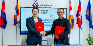 Representatives of the Cambodia Tourism Board and Chaktomuk Short Film Festival shake hands after signing a tourism and film promotion agreement in Phnom Penh.