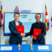 Representatives of the Cambodia Tourism Board and Chaktomuk Short Film Festival shake hands after signing a tourism and film promotion agreement in Phnom Penh.
