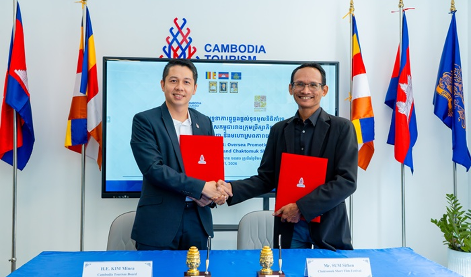 Representatives of the Cambodia Tourism Board and Chaktomuk Short Film Festival shake hands after signing a tourism and film promotion agreement in Phnom Penh.